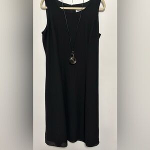 Simple styling little black dress. Very flattering size 16x